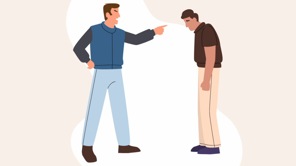 Image de deux hommes debout. Celui de gauche crie sur celui de droite et le pointe du doigt